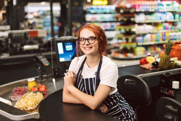 pretty-smiling-cashier-in-eyeglasses-and-striped-a-JX2M4Z5
